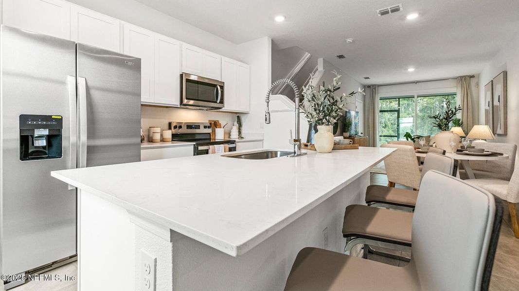 Furnished interior in a model home at Cordera Townhomes in St. Augustine (Image 13).