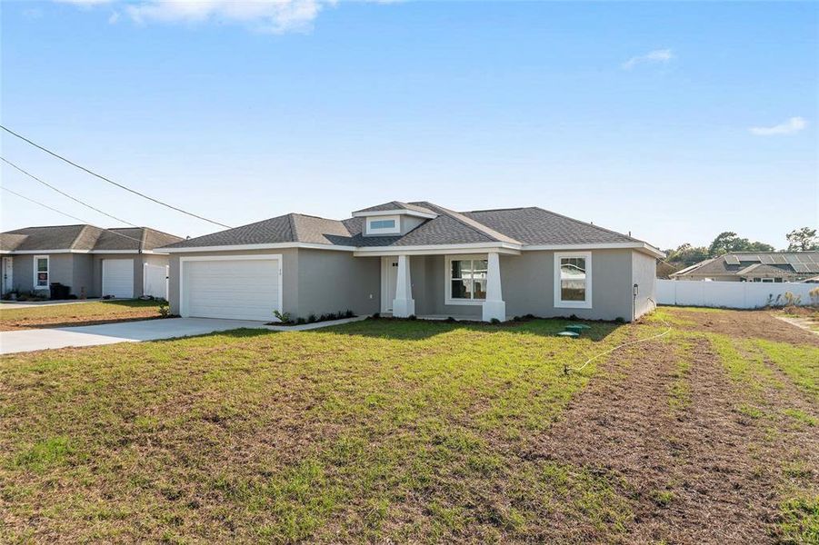 Front exterior of a new home in , Ocala, FL, highlighting curb appeal (Image 26). Front exterior of a new home in , Ocala, FL, highlighting curb appeal (Image 26).