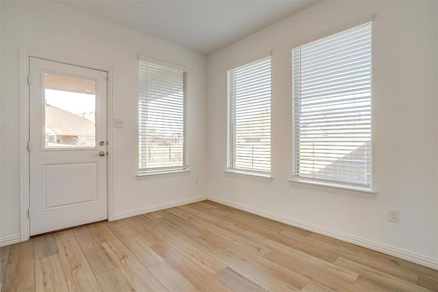 Entryway with light hardwood / wood-style floors