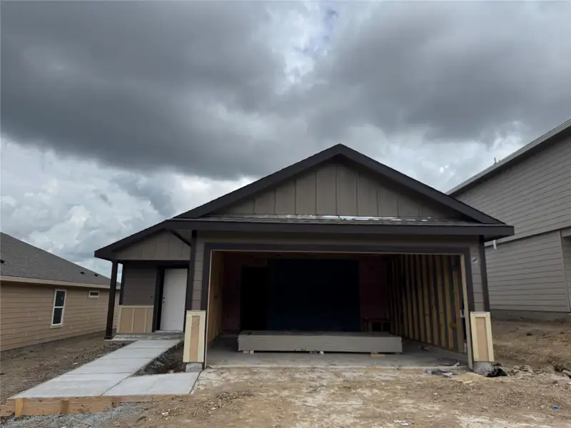 Front exterior of a new home in Wilkins Valley, Brenham, TX, highlighting curb appeal (Image 2). Front exterior of a new home in Wilkins Valley, Brenham, TX, highlighting curb appeal (Image 2).
