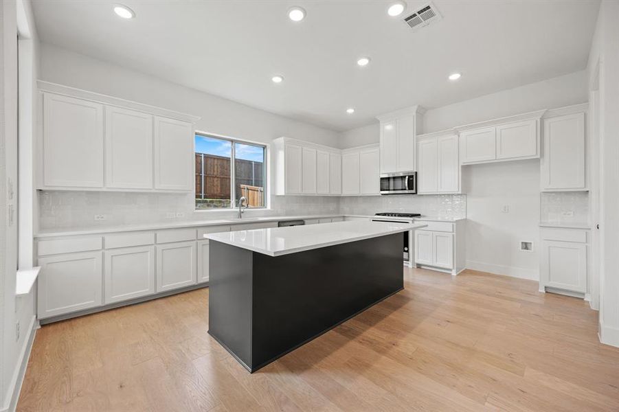 Furnished interior view inside a new home in North Square at Uptown, Celina (Image 5).