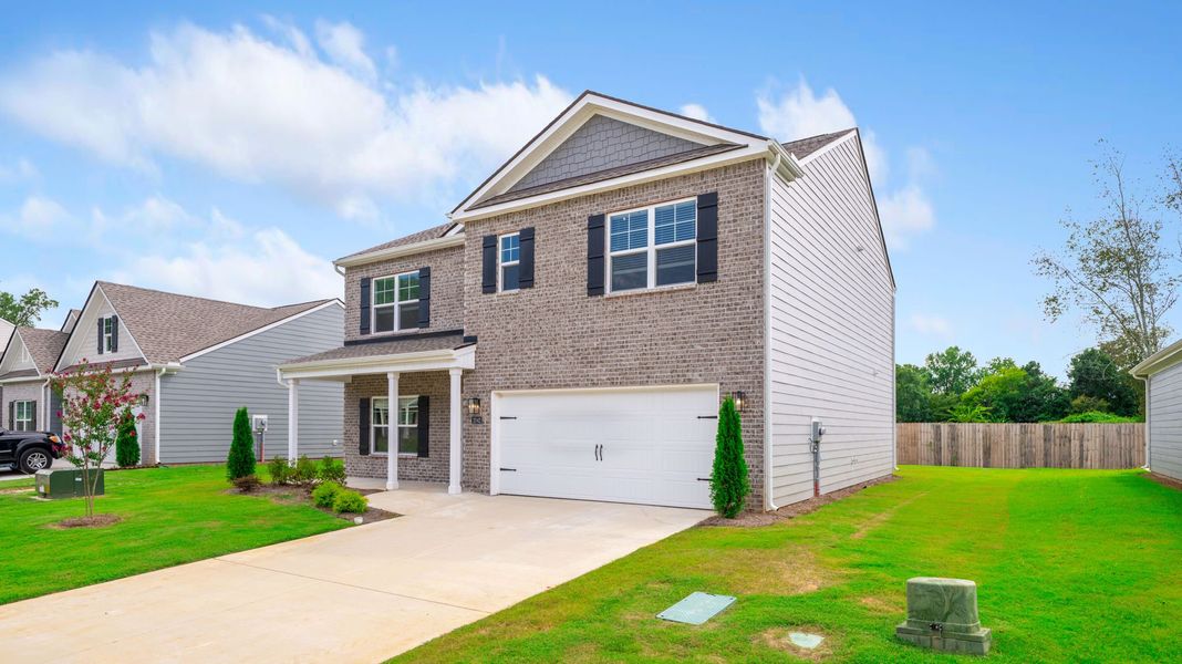 Front exterior of a new home in Fairview Hills, Cleveland, TN, highlighting curb appeal (Image 2).