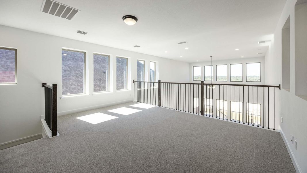 Spare room with carpet floors and baseboards