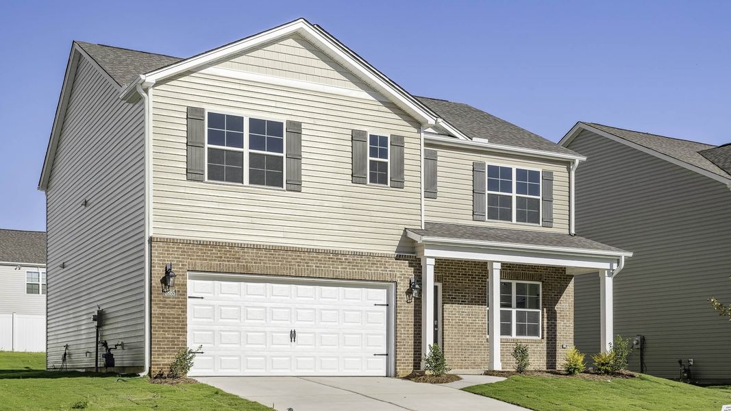 Front exterior of a new home in Cambridge Park, Mebane, NC, highlighting curb appeal (Image 12). Front exterior of a new home in Cambridge Park, Mebane, NC, highlighting curb appeal (Image 12).