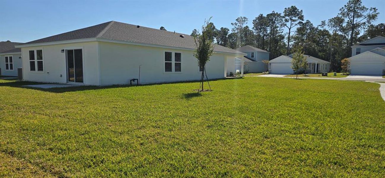 Exterior details and patio area of a home in Flagler Village - Classic Series, Palm Coast (Image 4).