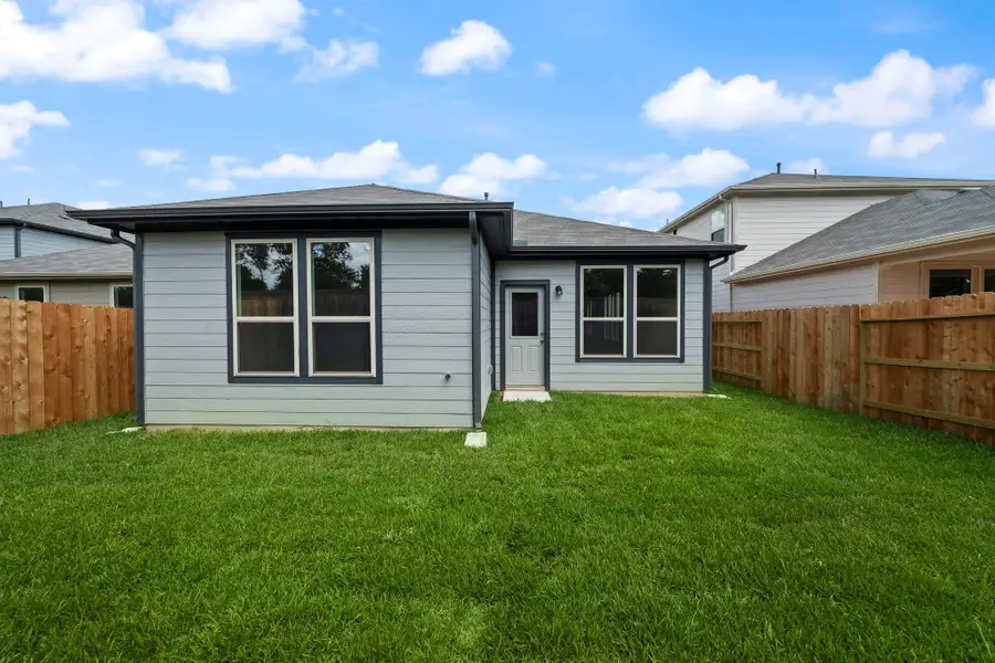 Front exterior of a new home in , Conroe, TX, highlighting curb appeal (Image 8).