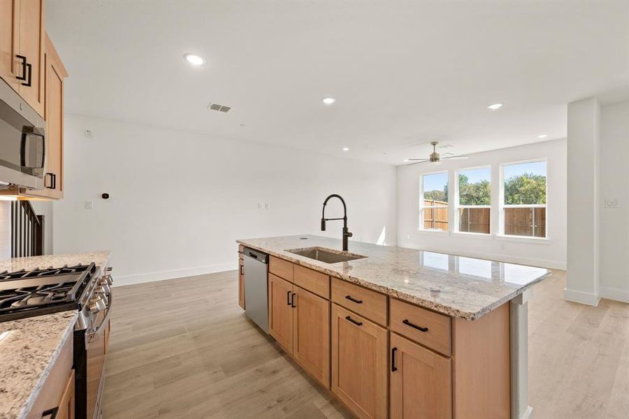 The chef will never be left out of the party in this outstanding kitchen! The chef will never be left out of the party in this outstanding kitchen!
