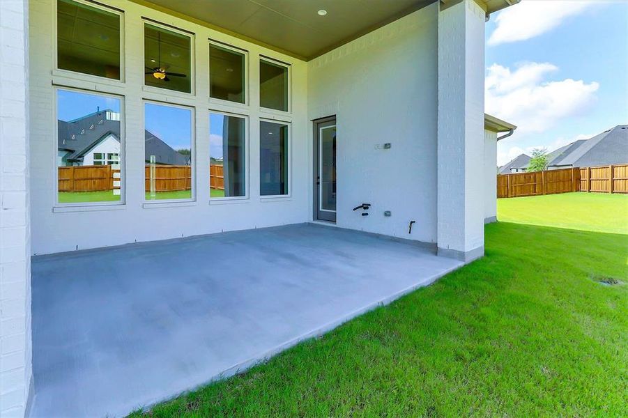 Covered outdoor patio featuring a concrete slab and direct access to a private backyard Covered outdoor patio featuring a concrete slab and direct access to a private backyard
