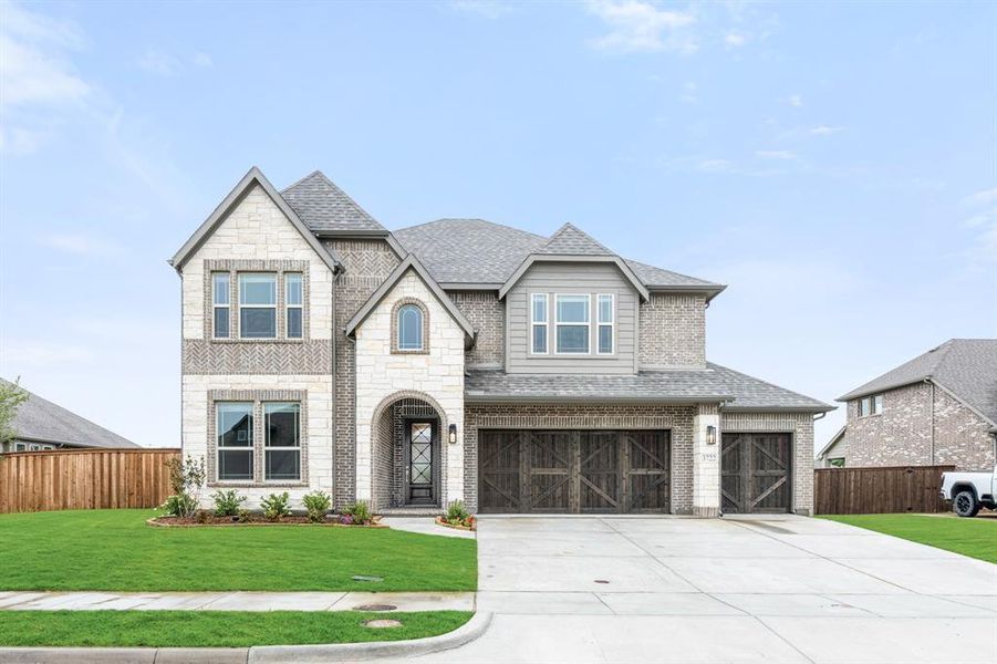 Front exterior of a new home in Terracina, Rockwall, TX, highlighting curb appeal (Image 2).