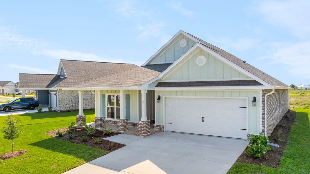 Front exterior of a new home in Owl's Head Farms, Freeport, FL, highlighting curb appeal (Image 2).