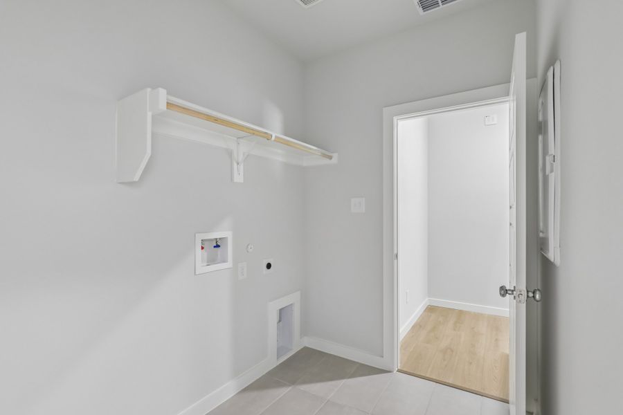 Utility in the Holden home plan by Trophy Signature Homes