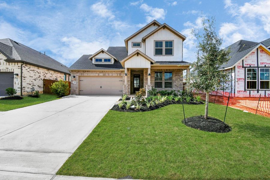 Front exterior of a new home in Elyson, Katy, TX, highlighting curb appeal (Image 24). Front exterior of a new home in Elyson, Katy, TX, highlighting curb appeal (Image 24).
