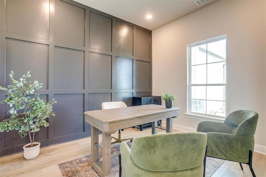 Office area featuring light hardwood / wood-style floors