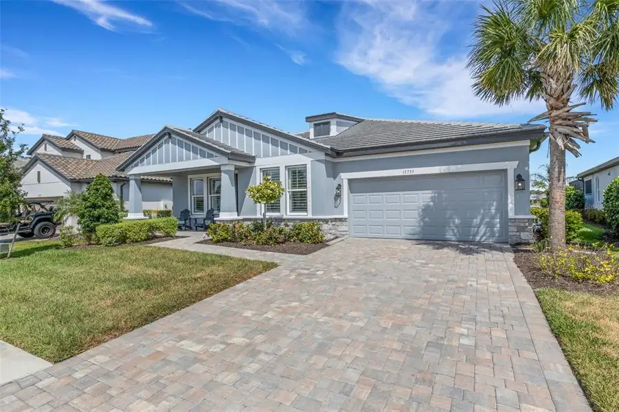 Front exterior of a new home in , Bradenton, FL, highlighting curb appeal (Image 27).