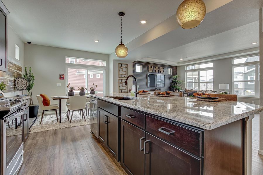 Adjacent to the kitchen, the dining room offers a seamless transition for hosting memorable gatherings, with a sliding glass door leading to a deck where you can dine al fresco or simply soak in the sunshine.