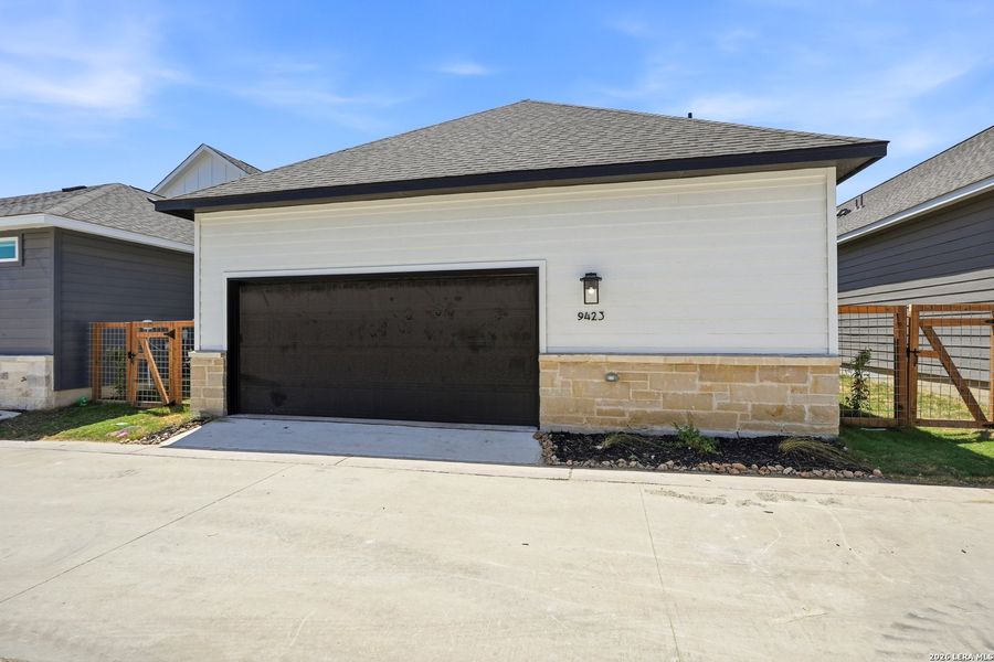 Front exterior of a new home in The Crossvine, Schertz, TX, highlighting curb appeal (Image 22).