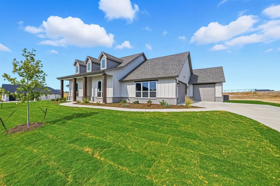 Front exterior of a new home in Rocky Top Ranch, Reno, TX, highlighting curb appeal (Image 2). Front exterior of a new home in Rocky Top Ranch, Reno, TX, highlighting curb appeal (Image 2).