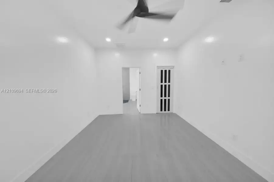 Interior space featuring wood-finish flooring, recessed lighting, and a ceiling fan