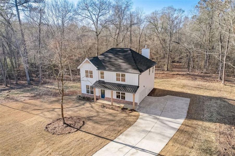 Front exterior of a new home in , Mansfield, GA, highlighting curb appeal (Image 2). Front exterior of a new home in , Mansfield, GA, highlighting curb appeal (Image 2).