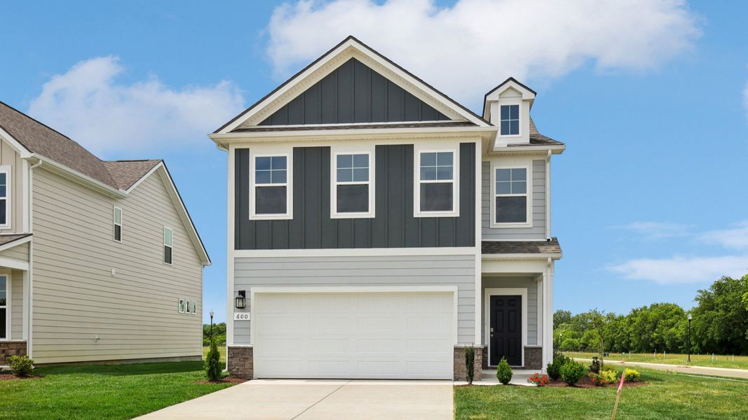 Home exterior with two tone blue siding and 2-car garage Home exterior with two tone blue siding and 2-car garage