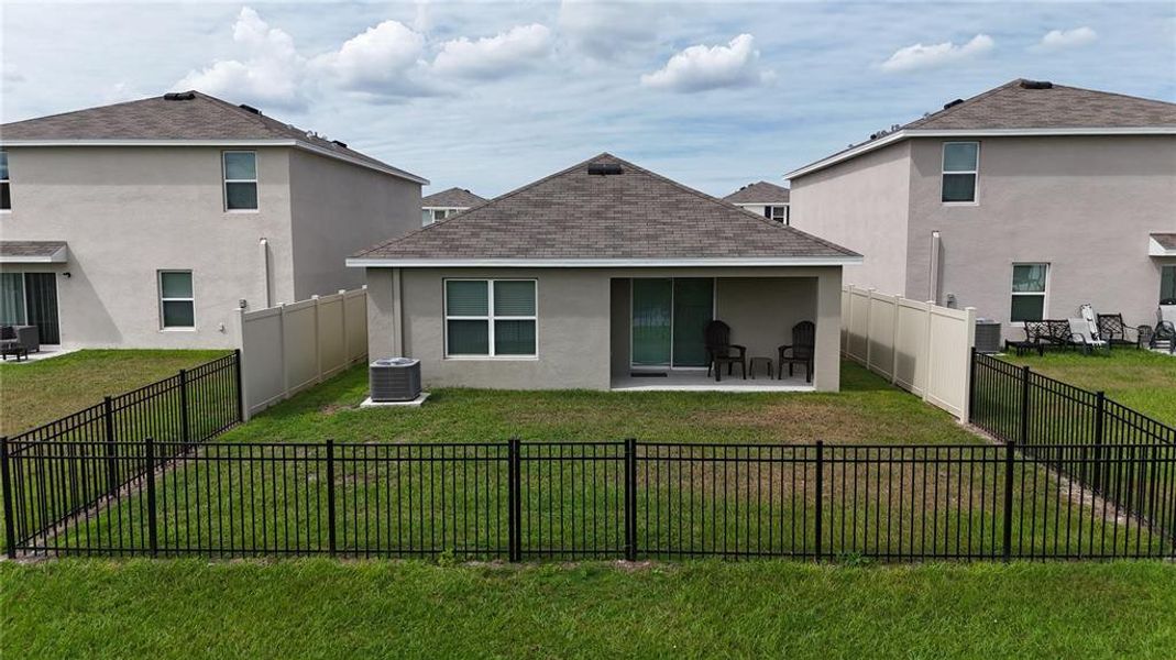 Exterior details and patio area of a home in Bella Lago, Parrish (Image 19).