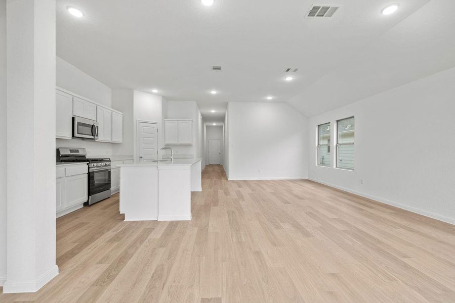 Kitchen and Dining Area in the Quartz home plan by Trophy Signature Homes – REPRESENTATIVE Kitchen and Dining Area in the Quartz home plan by Trophy Signature Homes – REPRESENTATIVE