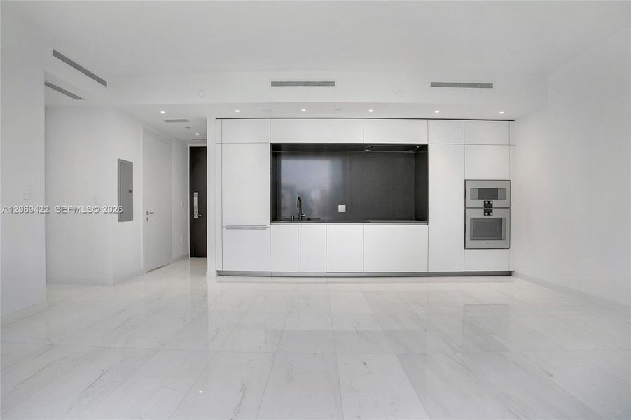 Spacious, unfurnished interior of a new home in Aston Martin Residences, Miami (Image 8). Spacious, unfurnished interior of a new home in Aston Martin Residences, Miami (Image 8).