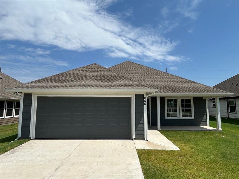 Front exterior of a new home in , Trenton, TX, highlighting curb appeal (Image 13). Front exterior of a new home in , Trenton, TX, highlighting curb appeal (Image 13).