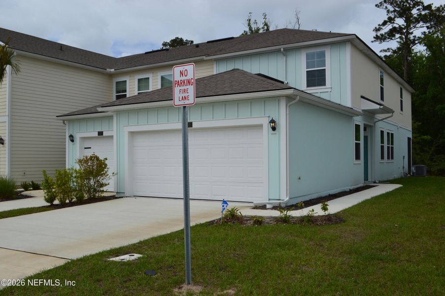 Front exterior of a new home in , St. Augustine, FL, highlighting curb appeal (Image 16).