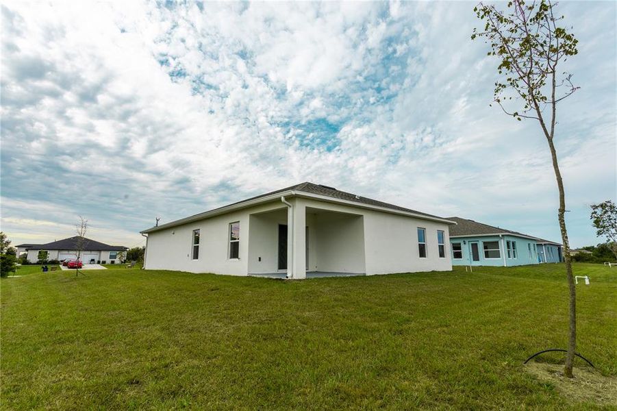 Front exterior of a new home in , Lehigh Acres, FL, highlighting curb appeal (Image 1). Front exterior of a new home in , Lehigh Acres, FL, highlighting curb appeal (Image 1).