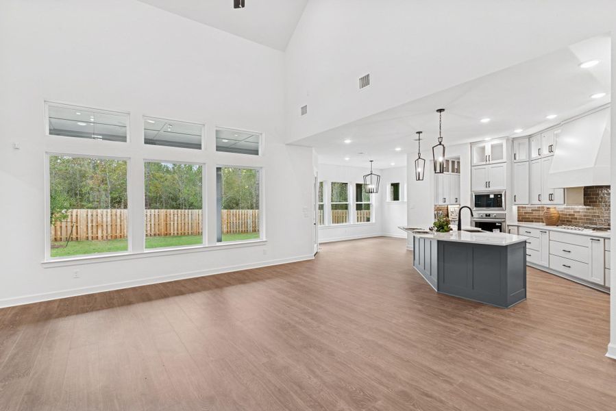 LOTS of light with these big windows that span across rear of home and bring the outside in!