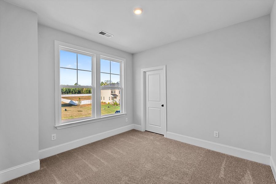 Spacious, unfurnished interior of a new home in Lilah Grove, Summerfield (Image 36).