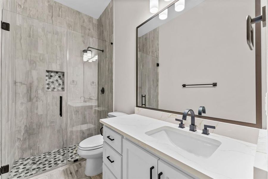 Secondary bathrooms include ceramic tile backsplash & elongated commodes