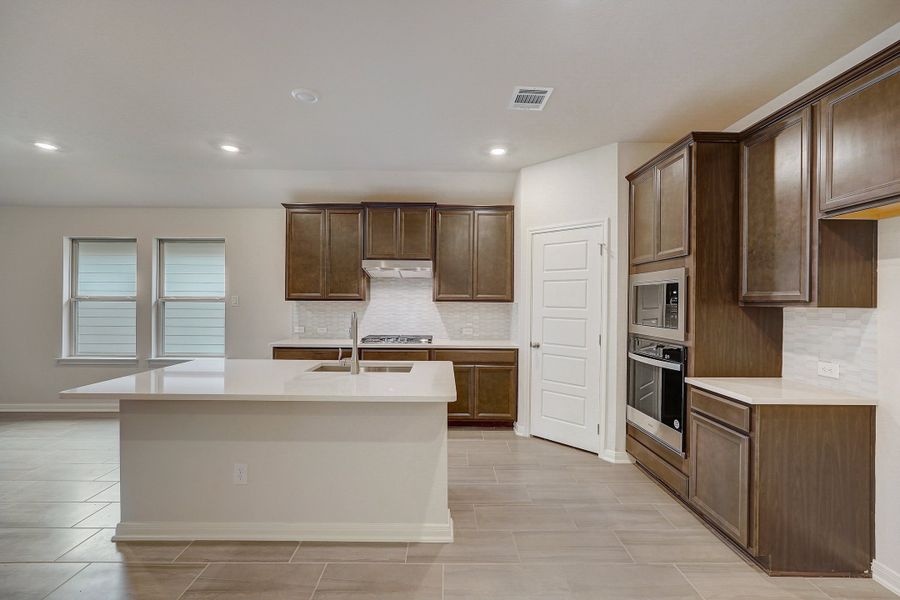 Kitchen in the Oleander floorplan at a Meritage Homes community.