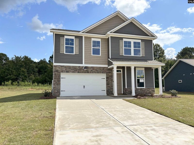 Front exterior of a new home in Rolling Hills, Prosperity, SC, highlighting curb appeal (Image 1).