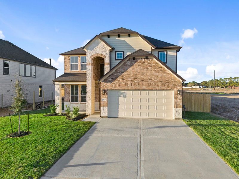 Front exterior of a new home in Briarwood Crossing, Rosenberg, TX, highlighting curb appeal (Image 21).