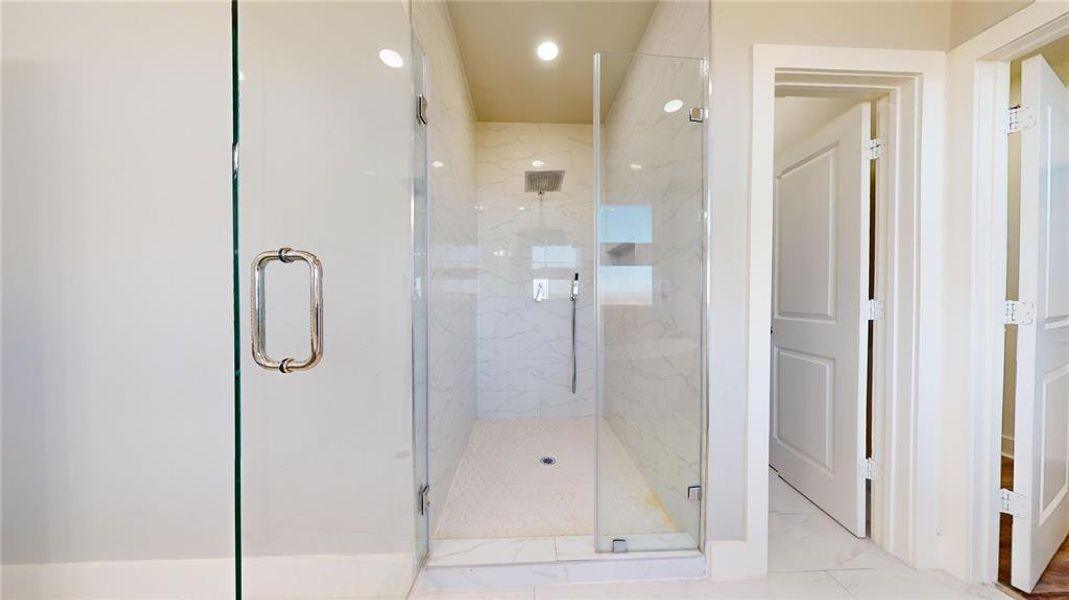 Large walk-in shower in the primary bath.