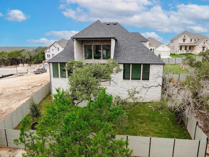 Exterior details and patio area of a home in Wolf Ranch West Bend - 60', Georgetown (Image 4).