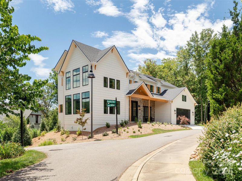 Front exterior of a new home in , Asheville, NC, highlighting curb appeal (Image 23).