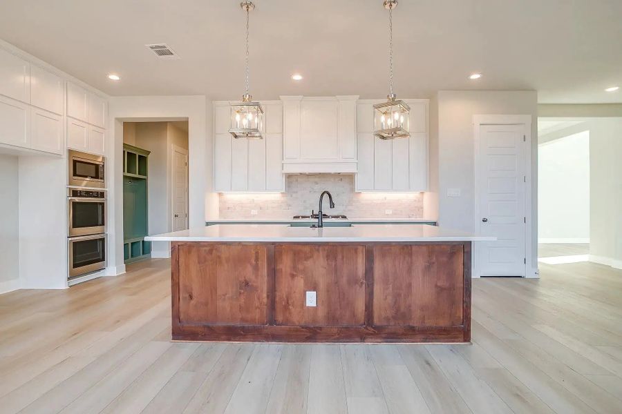 Representative furnished interior of a home built from the The Landry by Elmwood Custom Homes in Ranch at Stone Hill, Waxahachie (Image 20). Representative furnished interior of a home built from the The Landry by Elmwood Custom Homes in Ranch at Stone Hill, Waxahachie (Image 20).