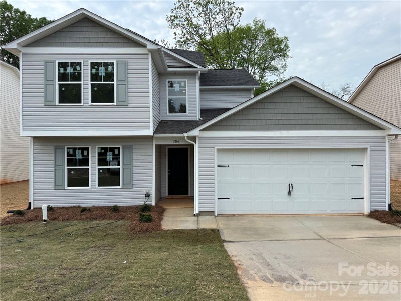 Front exterior of a new home in , Lancaster, SC, highlighting curb appeal (Image 14).