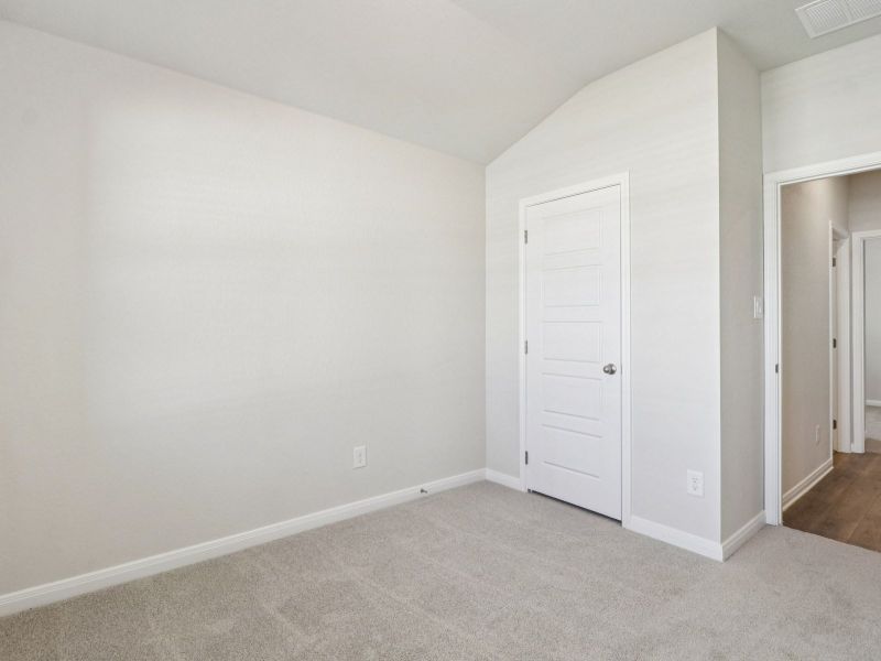 Guest bedroom in the Callaghan floorplan at a Meritage Homes community.