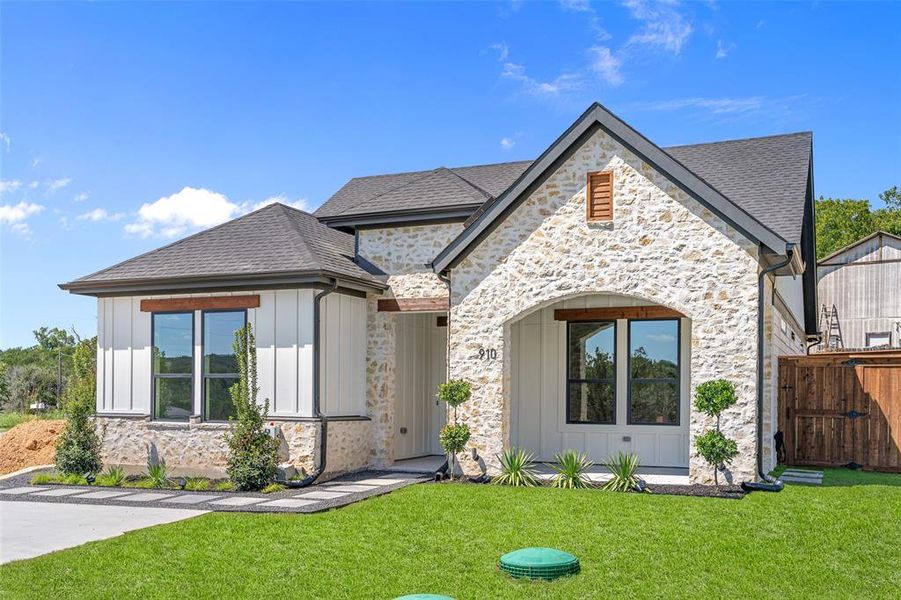 View of front of home with a front lawn