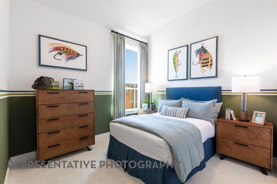 Carpeted bedroom featuring baseboards