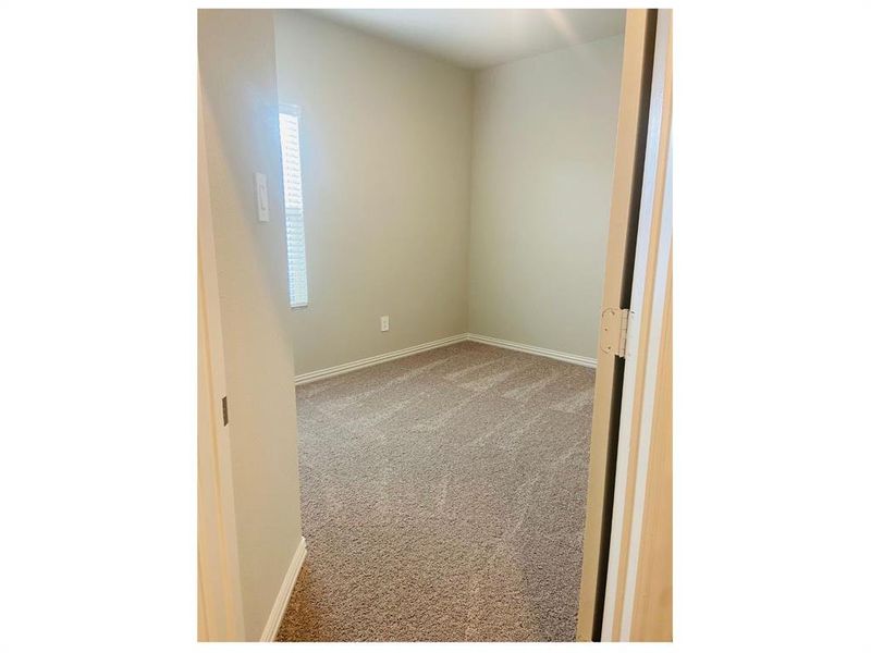 View of Primary bedroom carpeted empty room