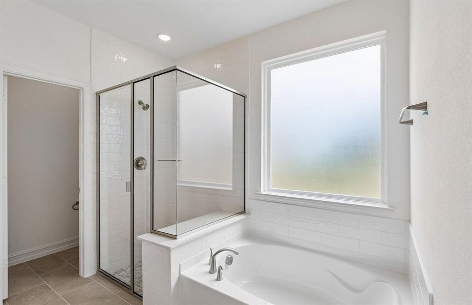 Primary bath with separate tub and shower Primary bath with separate tub and shower