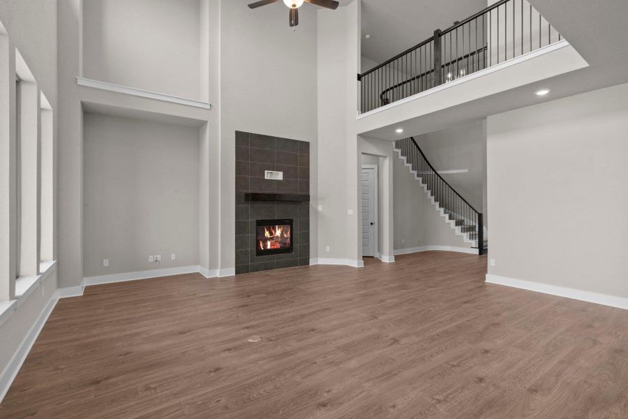 Family Room with soaring ceiling & fireplace