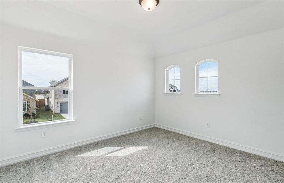 Spacious secondary bedroom with large windows Spacious secondary bedroom with large windows