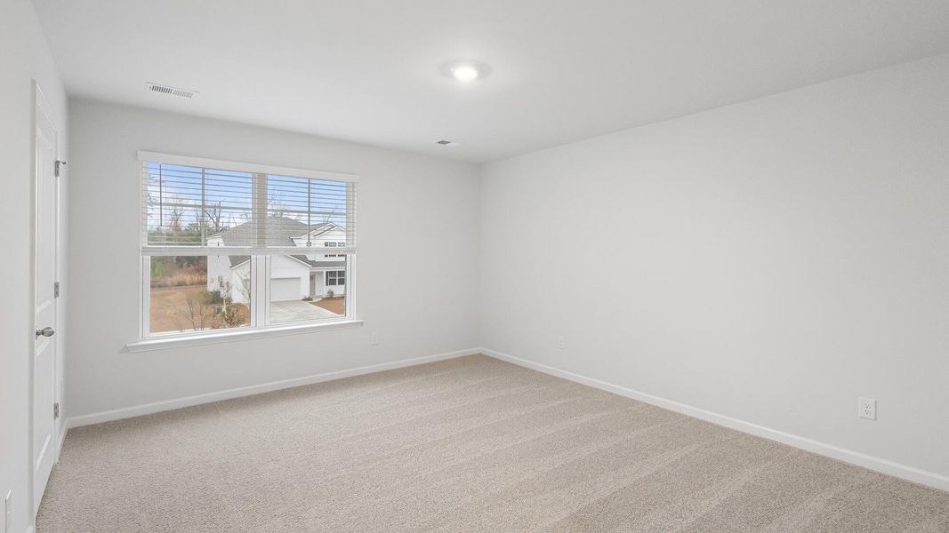 Spacious, unfurnished interior of a new home in Pine Hills at Cane Bay, Summerville (Image 11).