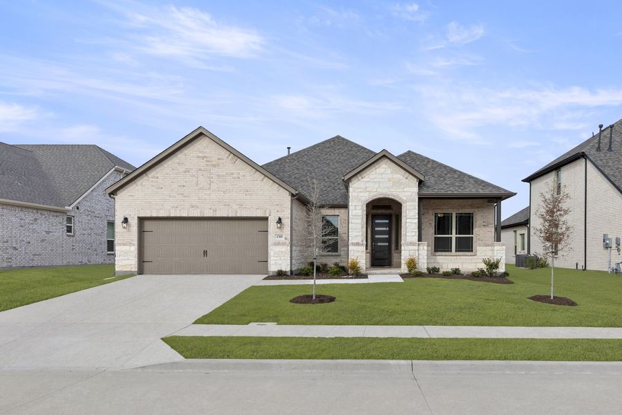 Front exterior of a new home in Anna Town Square, Anna, TX, highlighting curb appeal (Image 1). Front exterior of a new home in Anna Town Square, Anna, TX, highlighting curb appeal (Image 1).